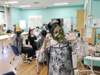 A student dressed up with a scary mask