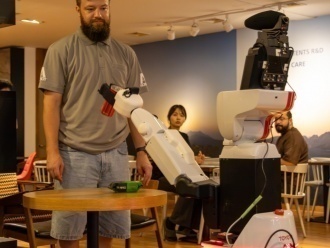 HSR grasping an ordered item
